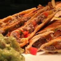 Quesadilla · Your choice ,  chicken or steak. Flour Tortilla, jack and cheddar cheese, with sides of pico...