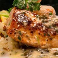 Blackened Mahi Mahi · blackened mahi mahi with a lemon caper sauce, served with basmati rice & mixed vegetables.