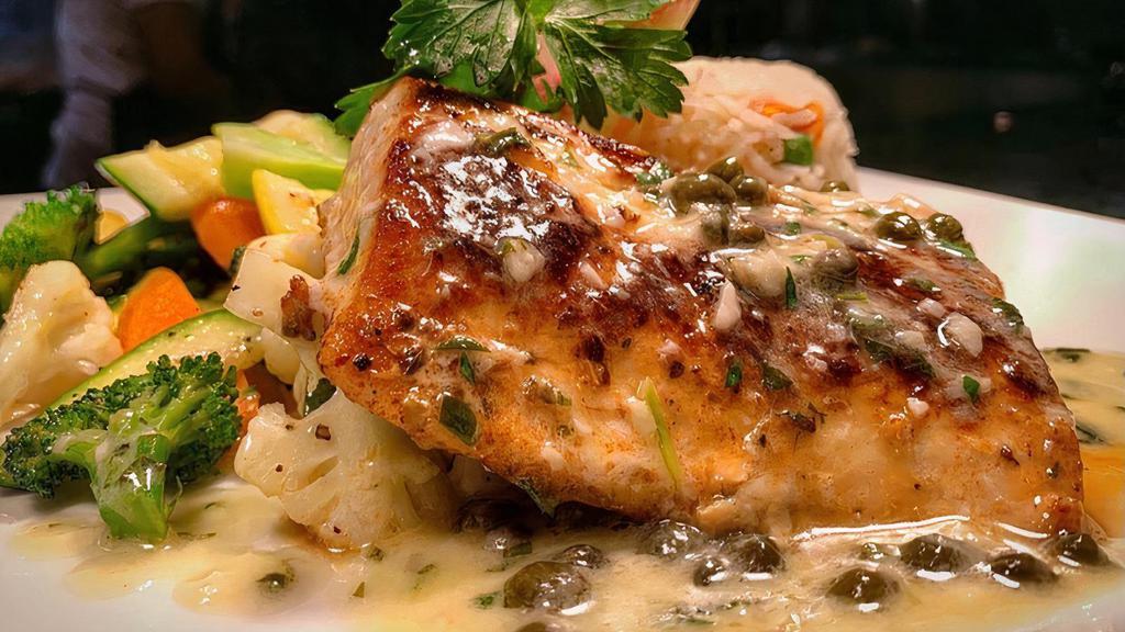 Blackened Mahi Mahi · blackened mahi mahi with a lemon caper sauce, served with basmati rice & mixed vegetables.