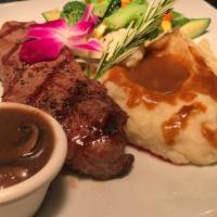 New York Steak · 12 oz. of New York steak with a gorgonzola cream sauce, served with mixed vegetables and gar...