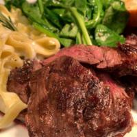 Steak fettuccine · Grilled skirt steak, served with a side of fettuccine in a gorgonzola cream sauce, sauteed s...