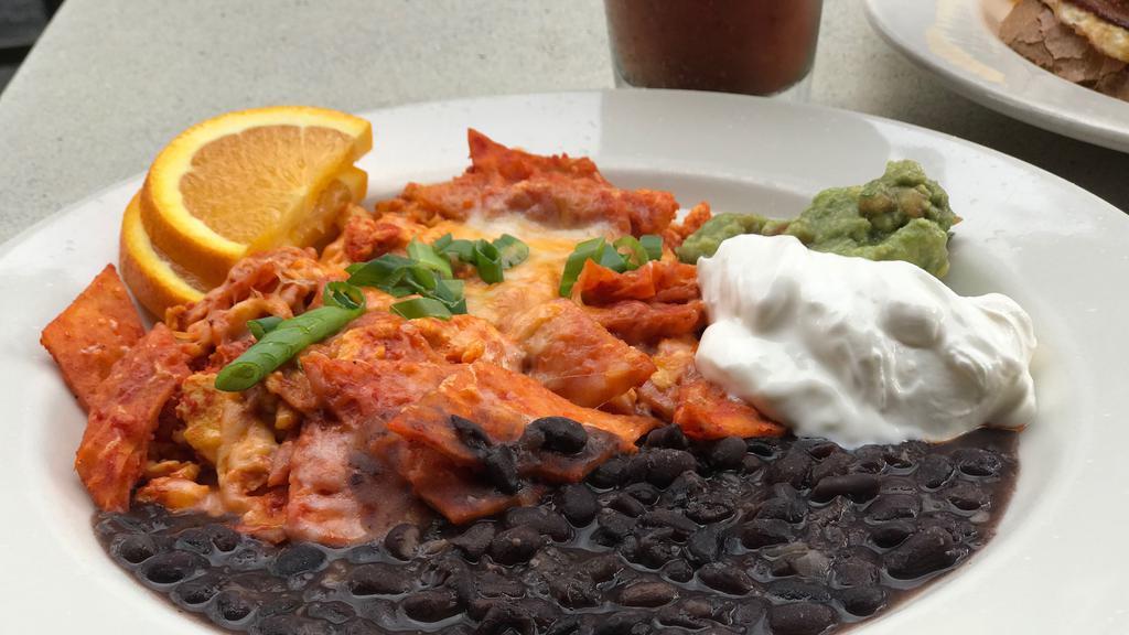 Chilaquiles (ONLY Friday:  12-3 pm I Saturday and Sunday : 10 am - 3 pm) · Scrambled eggs with tortilla chips, cheddar cheese, homemade salsa verde or roja & scallions, served with black beans, guacamole & sour cream.