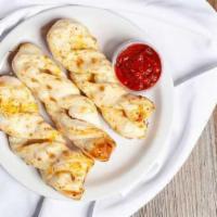 Garlic Parmesan Twists (24 Pieces) · Our famous Garlic Parmesan Twists. Rolled fresh daily and baked to perfection with fresh gar...