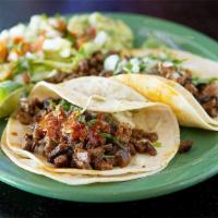 Taco · Your choice of meat, onions, and cilantro.