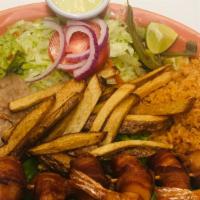 Camarones Momia · Bacon wrapped jumbo shrimp served with rice, beans, salad, French fries, and guacamole.