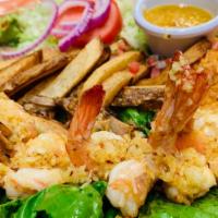 Camarones A La Mojo De Ajo · Jumbo shrimp cooked with butter and fresh garlic served with rice, beans, salad, French frie...