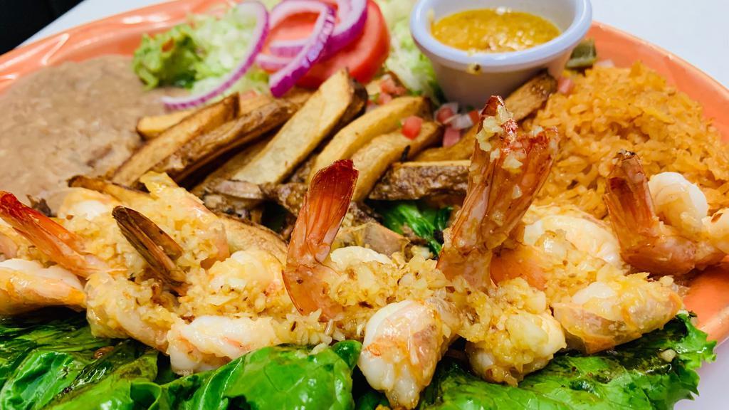 Camarones A La Mojo De Ajo · Jumbo shrimp cooked with butter and fresh garlic served with rice, beans, salad, French fries, and guacamole.
