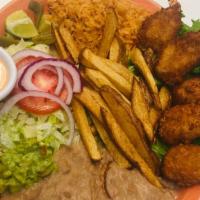 Camarones Empanizados · Breaded jumbo shrimp served with rice, beans, salad, French fries, and guacamole.