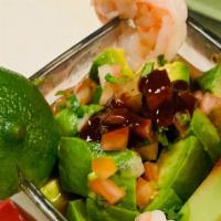 Coctel de Camaron Y Ostion · Shrimp and oyster cocktail. Served with tomato, onion, cilantro, avocado, and cucumber.