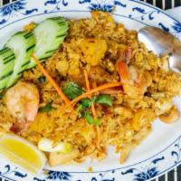 Thai Fried Rice · Pan fried steamed jasmine rice with a choice of chicken, pork, beef, mixed with tomatoes, eg...