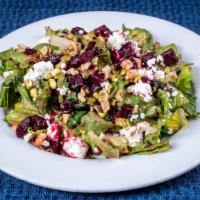 Beet & Goat Cheese Salad · Chopped romaine, steamed beets, goat cheese, and toasted walnuts, with tahini-balsamic dress...