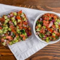 Israeli Salad · Chopped cucumber, tomato, onions, parsley, lemon, and olive oil (gf, v)