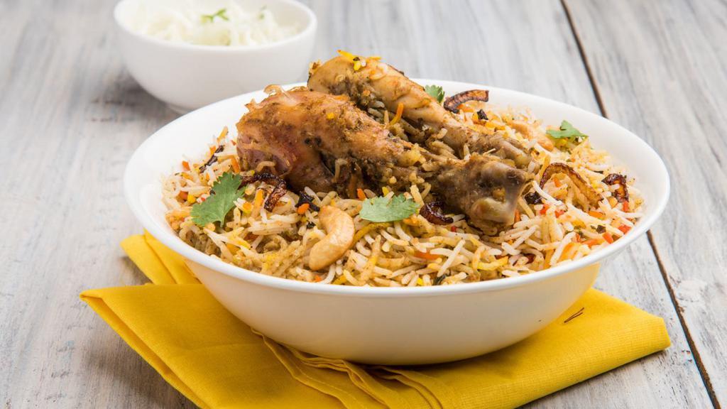 Chicken Biryani · An aromatic rice dish made with seasoned chicken, seeraga samba rice, and aromatic spices.