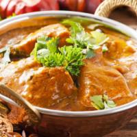 Fish Curry · Spicy dish made with slices of fresh cat fish cooked with authentic spices in a tamarind-bas...
