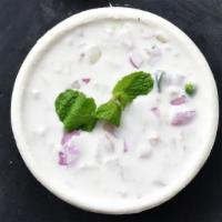 Side of Raita  · A side dish made of yogurt, diced cucumber and seasonings.