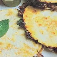Mulita · Similar in size to the street taco, a Mulita is like a small quesadilla. Tortilla, cheese an...