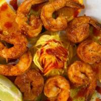 Micheladas Shrimps · 9 grill jumbo shrimp mild spicy chipotle sauce, cucumber and oranges slices