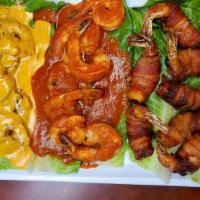 Trebol Costero · Three shrimp dishes in one, Diabla, Chipotle cream and bacon wraps, green or red rice and co...