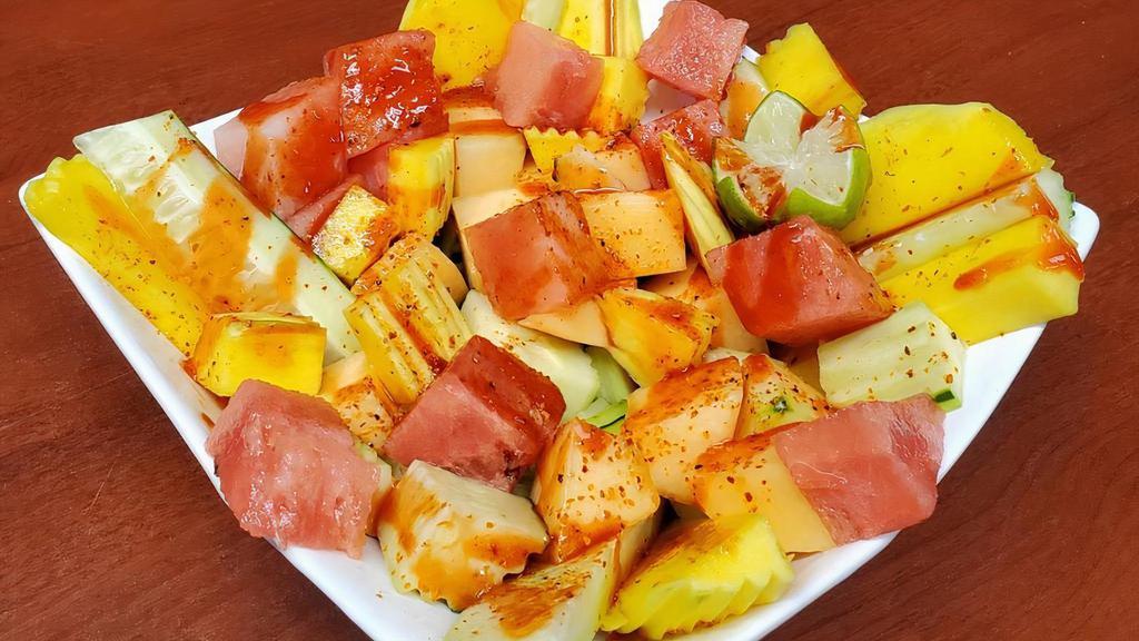 Botana de Frutas · Pineapple, watermelon, cucumber, mango, cantaloupe, lemon, Tajin and chamoy
