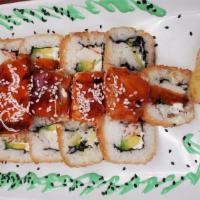 Salmon Roll · Philadelphia cheese, cucumber, avocado inside, grilled salmon with honey chipotle outside.
