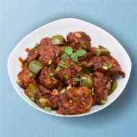 Chicken Manchurian Madness (DRY) · Chicken morsels, seasoned, batter fried and sauteed with green onions and an Indo-Chinese Ma...