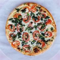White Pizza · Creamy white Garlic Sauce, Spinach, Artichokes, Fresh Basil, Feta cheese and mozzarella.