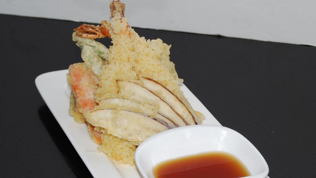 Shrimp/Veg Tempura Udon/D · Plate of two tiger shrimp and vegetable tempura with bowl of udon