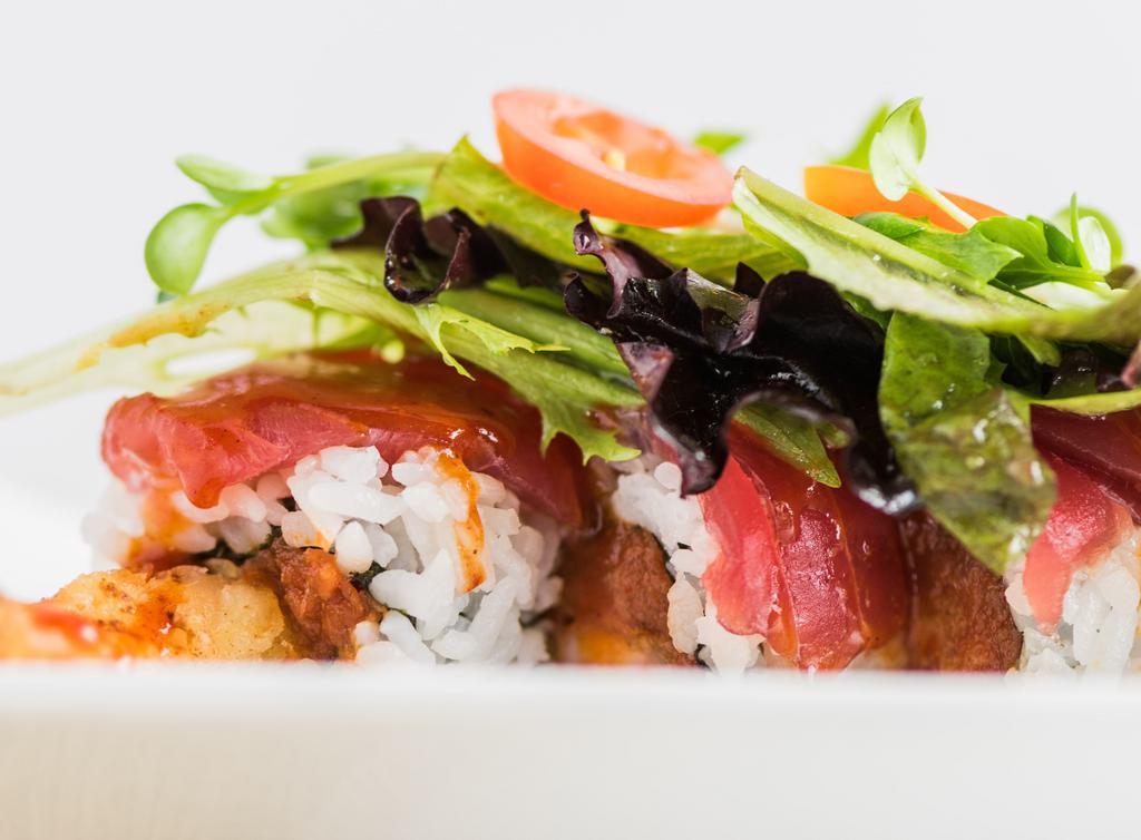 Red Evil · Spicy tuna & tempura shrimp topped with fresh tuna & spring mix with sliced red onion & vinegar dressing
