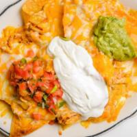 Nachos · Chips with red sauce, refried beans Melted cheese, guacamole, sour cream and salsa.