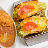 Crispy Tacos · Two crispy corn tortillas filled with lettuce, tomato and cheese on top. *** PLEASE NOTE: Pi...
