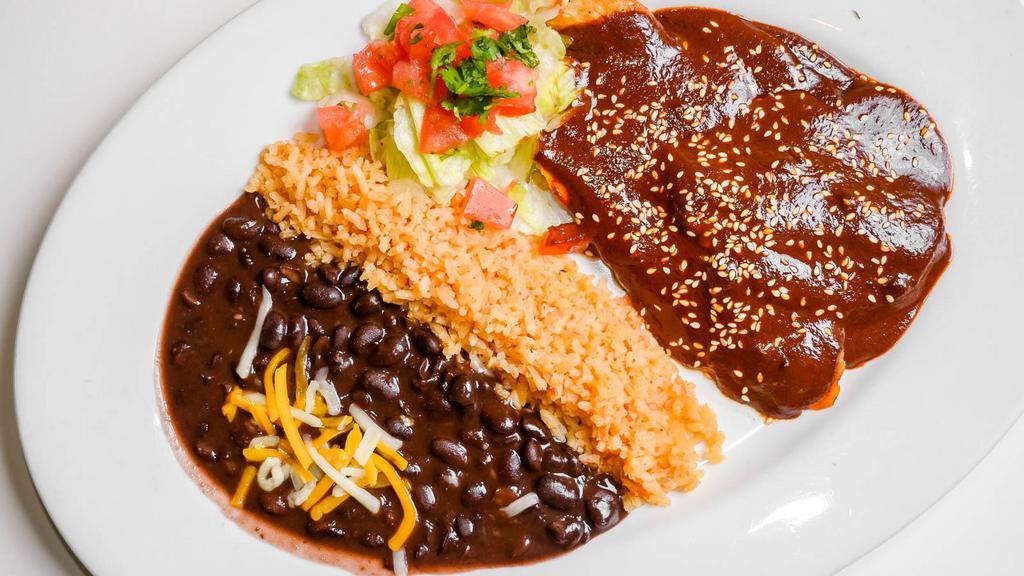 Pollo En Mole · Breast of chicken simmered in mole sauce with sesame seeds. *** PLEASE NOTE: Pinto Beans and Side Salads are NOT available. ***
