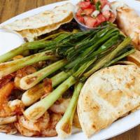 Fiesta Platter · Nachos, garlic prawns, chicken flauta, corn quesadilla, grilled onions, guacamole, sour crea...