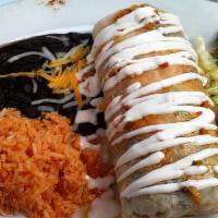 Vallarta Burrito · Prawns sautéed garlic butter, choice of beans, rice, and avocado, topped with cheese and sou...