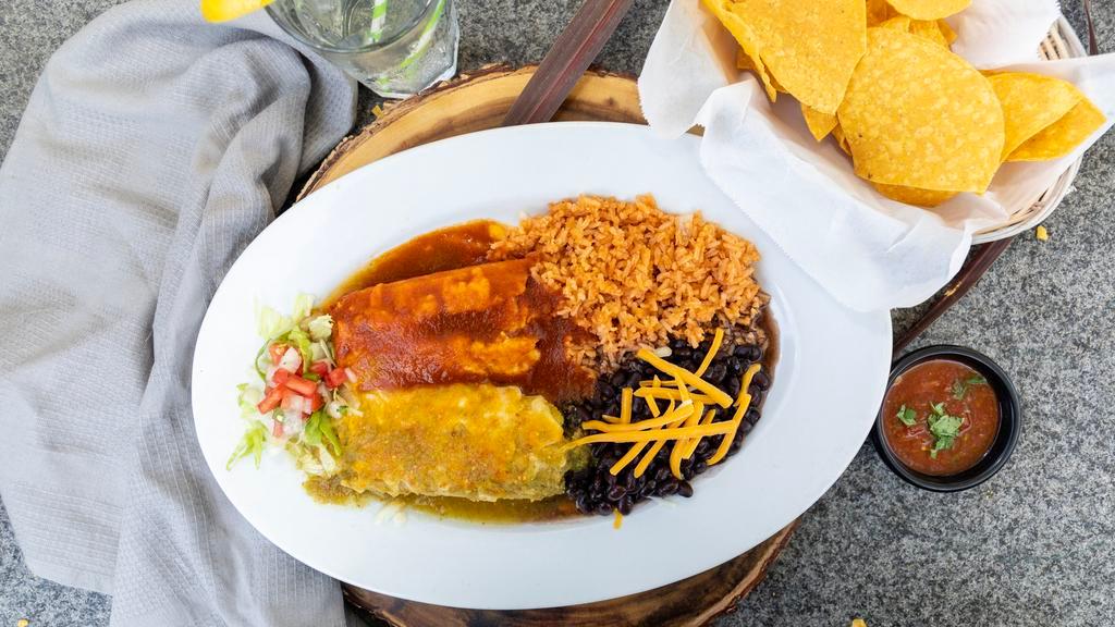 Tamale (Light) · One shredded pork tamale topped with our red chile sauce and cheese OR one shredded chicken tamale in our fresh tomatillo green sauce, topped with cheese.