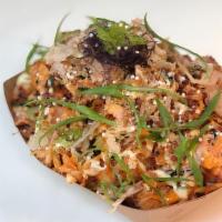 Poké Tots (small size) · Tater tots topped with our house salmon poké, kimchi coleslaw, cheese, seaweed, tobiko, onio...