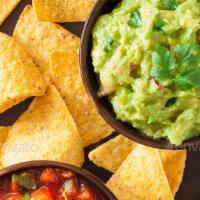 Side of Guacamole · Mashed avocado mixed in tomato, onion, cilantro and flavored with lemon and salt.