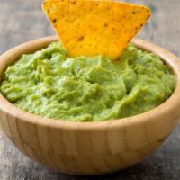 Chips and Guacamole · Corn chips with side of guacamole.