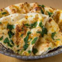 Garlic Naan · Naan with roasted garlic and fresh cilantro.