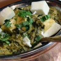 Saag Paneer · Fresh spinach & other select greens pureed & mixed with chunks of homemade cheese (paneer), ...