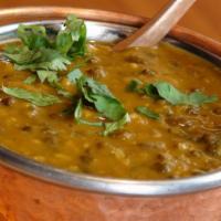 Dal Makhani · Black lentils and red kidney beans simmered with tomatoes, ginger, garlic and finished with ...