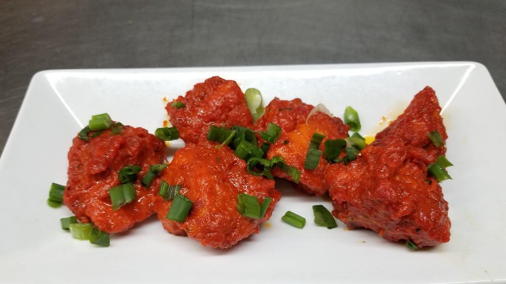 Paneer Chili · Chunks of our homemade cheese (paneer) mixed with bell peppers, sweet onions, fresh green chilies and cooked in our blend of special herbs & spices.