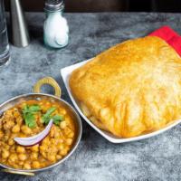 Cholay Bhatura · Garbanzo beans cooked in Indian spice served with two freshly fried bhature (fried naan).