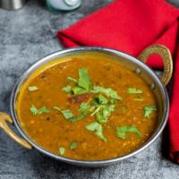 Let's Split Dal Tadka · Split pea lentil cooked with garlic, tomato, mustard, and curry leaves - a very good, groovy...