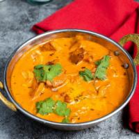 Buttered-Up Chicken · This righteous tandoori chicken is cooked in a groovy yogurt and creamy tomato gravy with fr...