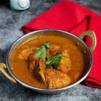 Free-Love Chicken Curry · Peace out with free-range chicken breast in a tomato based onion gravy with freshly ground s...