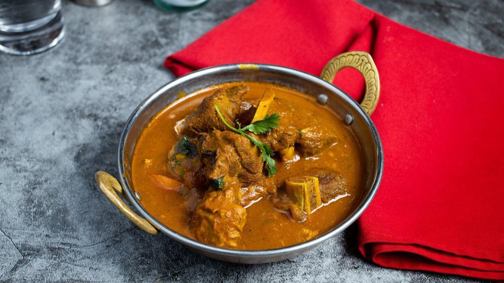 Lovin' Goat Curry · Scarf up this goat cooked in a tomato based onion gravy with freshly ground spices.