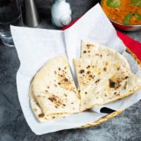 Tandoori Roti · Whole wheat Indian bread cooked in a clay oven. A bread you'll be lovin'.