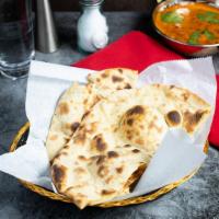Naan · Oven lovin' with freshly baked bread in a clay oven.