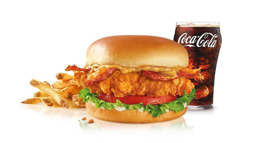 Gold Digger Hand Breaded Chicken Sandwich Combo · A tender all-white meat chicken breast fillet, hand battered and breaded, topped with sweet Carolina Gold sauce, bacon, tomato, green leaf lettuce and mayo; served on a toasted potato bun. Served with a Small Drink and Small Fry..