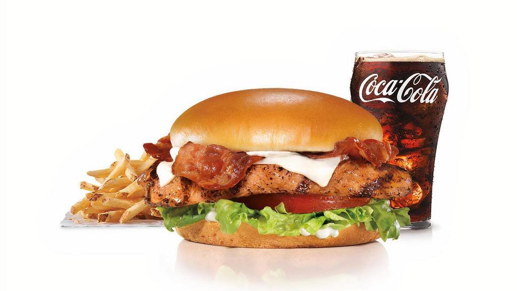 Charbroiled Chicken Club™ Sandwich Combo · Charbroiled chicken breast, two strips of Bacon, melted Swiss cheese, lettuce, tomato and mayonnaise on a honey wheat bun. Served with Fries and a Beverage.